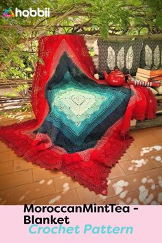 a blanket that is sitting on top of a bench with the words moroccan minted blanket crochet pattern