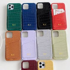 six cell phones are lined up in rows with the same color as each phone case