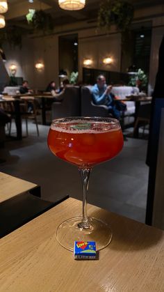 a drink sitting on top of a wooden table