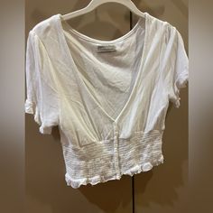 Selling A Ton Of Clothes That Just Don’t Fit Anymore/Never Worn/ Hardly Worn. Pls Look At My Page And Bundle!!:) Cream Smocked Crop Top Blouse. Condition: Very Good Size: Medium Summer Cropped Tops For Daywear, Urban Outfitters White V-neck Tops, Urban Outfitters V-neck Crop Top, Urban Outfitters V-neck Summer Blouse, Trendy V-neck Tops From Urban Outfitters, Trendy V-neck Blouse By Urban Outfitters, Urban Outfitters Short Sleeve Summer Blouse, Urban Outfitters Fitted Blouse For Vacation, Fitted Blouse For Vacation By Urban Outfitters