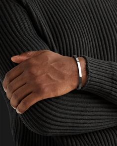 Whether you're looking for a traditional look or something newer, this cuff for men is a timeless piece of jewelry that you can wear for official events and everyday life.When choosing a men's jewel, ensure the style and material match your outfit. Choosing a comfortable men's bracelet is essential in ensuring it fits perfectly.Their exteriors and minimal shape allow the precious metal plating to shine through. You can wear them alone or with other minimal accessories with similar tones. This is the perfect piece to accessorize your wardrobe. Metal: 925 Sterling Silver / 24k Gold Plated / Rhodium over 925 Sterling Silver Dimensions: 6 mm W One Size Fits Most The cuff can open and close, is a malleable metal and carefully can adjust to your wrist. Type: Cuff 100% Handcrafted Package: High q Mens Wrist Accessories, Men Bracelet Silver, Men Silver Bracelet, Mens Accessories Bracelet, Mens Cuff Bracelets, Wrist Accessories, Mens Bracelets, Minimal Accessories, Mens Bracelet Silver