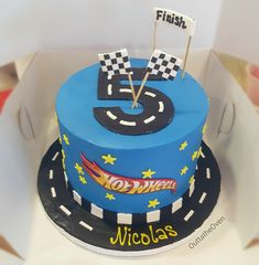 a birthday cake with the number five on it