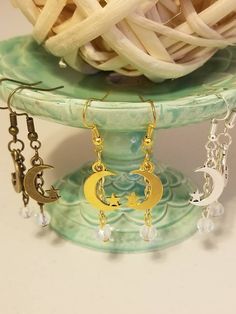 "A pair of hook earrings made with a moon charm and a 6mm moonstone crystal. Total length of earring is 2\". You choose gold, bronze, or silver." Earrings Moon, Celestial Earrings, Moon And Star Earrings, Moonstone Crystal, Moonstone Earrings, Moon And Star, Earrings Crystal, Moon Charm, Moon Earrings