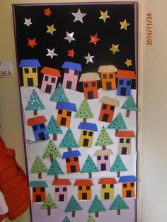 a door decorated with houses and trees