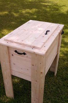 a wooden table sitting in the grass