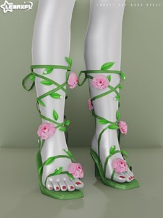 a pair of white sandals with pink flowers on them