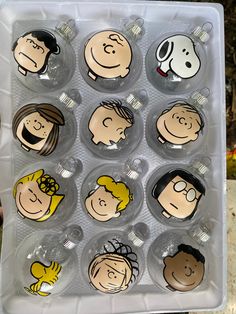 a plastic container filled with lots of cartoon characters