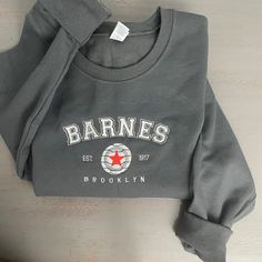 Barnes 1917 Embroidered Sweatshirt Celebrate timeless style and heritage with the Barnes 1917 Embroidered Sweatshirt. Featuring elegant embroidery that proudly showcases "Barnes 1917," this sweatshirt combines vintage-inspired design with modern comfort, making it a versatile staple for any wardrobe. Crafted from a premium cotton-poly blend, it offers a soft, cozy feel with durability that lasts. The relaxed fit and ribbed cuffs and hem provide a polished yet comfortable silhouette, perfect for Custom Embroidered Crew Neck Sweatshirt In Relaxed Fit, Custom Embroidery Relaxed Fit Crew Neck Sweatshirt, Relaxed Fit Sweatshirt With Custom Embroidery And Crew Neck, Relaxed Fit Crew Neck Sweatshirt With Custom Embroidery, Crew Sweatshirt With Embroidered Logo In French Terry, Gray Sweater With Embroidered Logo For Streetwear, Sporty Crew Neck Sweatshirt With Custom Embroidery, Streetwear Crew Sweatshirt With Custom Embroidery, Varsity Crew Neck Sweatshirt With Custom Embroidery