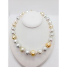 Beautiful estate necklace showcasing 27 white and yellow South Sea pearls and 0.50 ct. of white diamond rounds in a 18k yellow gold clasp.  Superb luster and minimal to no blemishes. The alternating white and yellow pearls make this classic necklace unique and fun.  Mint condition.  Metal: 18k Gold Stone: Diamond,South Sea Pearl Stone Cut: Round Cut  Dimensions for the item are unknown. Please reach out in the seller Q&A with questions Yellow Pearl Necklaces With Round Beads, White High Luster Round Beads Necklace, White High Luster Round Bead Necklaces, White High Luster Round Beaded Necklaces, Luxury High Luster White Pearl Necklace, Elegant Yellow Pearl Necklaces, Elegant Yellow Pearl Necklace, White Akoya Pearl Necklace With High Luster, White High Luster Pearl Necklace With Round Beads