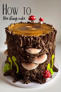 a cake made to look like a tree stump with mushrooms on it and the words how to