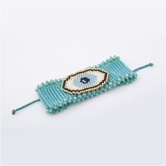 a beaded bracelet with an evil eye on it