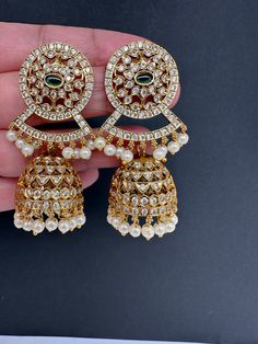 CZ Matte Jhumki Earrings Length : 2.75 Inches; Weight : 14 grams each Ready to ship from Boston, MA Heavy Dangle Jhumkas For Diwali, Heavy Drop Jhumkas For Diwali, Heavy Jhumkas For Diwali, Round Jhumkas With Latkans For Festivals, Heavy Drop Earrings For Navratri, Hand Set Drop Jhumkas For Diwali, Bollywood Style Hand Set Jhumkas For Festivals, Heavy Drop Danglers For Navratri, Festival Hand-set Round Chandelier Earrings