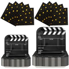 two black and gold movie claps with stars on the top one is folded in half