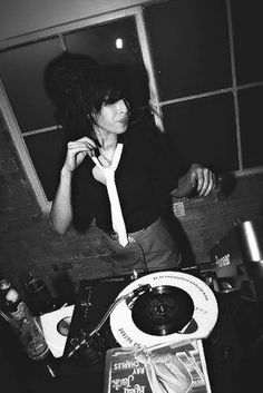 black and white photograph of a woman in the bathroom