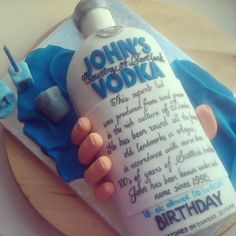 a birthday cake made to look like a vodka bottle