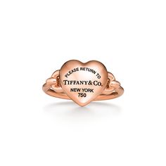 A bold expression of love, inspired by those who fill up your heart. Tiffany artisans have transformed the classic Return to Tiffany® tag into a three-dimensional heart with a special casting technique. The 18k rose gold pieces in this collection feature layers of black rhodium applied by hand for a striking finish. Playfully proportioned, each heart is hand polished for maximum shine. 18k rose gold; Motif size, mini | Return to Tiffany® Full Heart Ring in Rose Gold, Size: 7 Gold Tiffany Ring, Tiffany And Co Jewelry Gold, Tiffany Gold Ring, Tiffany Heart Ring, Tiffany Ring, Tiffany Co Rings, Gold Tiffany, Gold Motif, Tiffany Rings