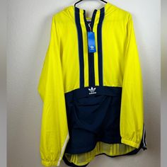 Please See Photos And Item Details For Size And Condition. Size Is Based On The Type Of Fit, The Manufacturer Size May Differ. Item Details - Nwt Brand New Adidas Anorak Jacket Mens Size Xl. Neon Yellow & Navy Colorway. Has Kangaroo Pouch. 3 Navy Stripes Down The Center. Has A Hood. All Items Are Guaranteed Authentic! All Items Are Free Of Stains, Rips, Or Tears Unless Otherwise Noted Or In Pictures. If You Have Any Questions Please Feel Free To Comment! Inv Bin2 Adidas Urban Long Sleeve Windbreaker, Adidas Hooded Windbreaker With Pockets, Adidas Yellow Outerwear For Streetwear, Yellow Track Jacket For Spring Streetwear, Functional Yellow Windbreaker For Outdoor Activities, Yellow Functional Windbreaker For Outdoor Activities, Adidas Yellow Long Sleeve Outerwear, Adidas Windbreaker For Streetwear With Pockets, Yellow Windbreaker With Pockets For Outdoor Activities