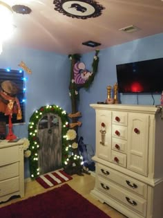 a bedroom decorated for christmas with lights and decorations