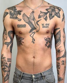 a man with lots of tattoos on his chest