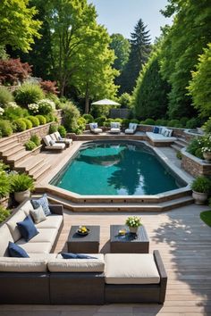 an outdoor living area with couches, tables and a pool in the middle of it