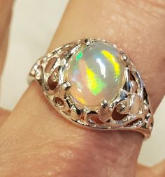 Magnificent Natural Rainbow Prism Opal, 9x7mm Ethiopian, Must see Video To Appreciate! 925 Sterling Silver Vintage Style Heart Ring, Size 8.25. Velvet Ring Box Included. Rainbow Prism, Opal Band, Velvet Ring Box, Rainbow Fire, Vintage Style Rings, Natural Rainbow, Favorite Rings, Natural Opal, Opal Rings