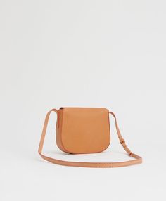 !!!Description---Our mini crossbody retains all the design details and function of the original hero. Made from our classic Vegetable Tanned leather, it features an adjustable strap and slim silhouette for comfortable carrying. !!!Fits---iPhone and smaller !!!Details--- Width: 6.3in / 16cmHeight: 5.9in / 15cmDepth: 1.6in / 4cmCrossbody Drop: Max 22.4 in / 57 cm, Min 17.3 in / 44 cm Composition: Self:100% Italian Vegetable Tanned LeatherLining: 100% Italian Canvas Made in Italy !!!Materials---Our Classic Leather Strap Crossbody Saddle Bag, Vegetable Tanned Leather Crossbody Saddle Bag, Sun Shadow, Lady M, Wallet Gifts, Black Sand, Monogrammed Items, Classic Mini, Mini Crossbody