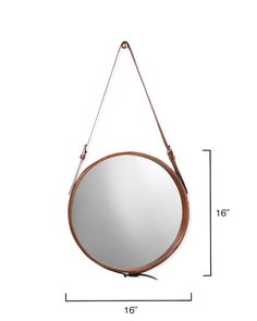 a round mirror hanging on a wall with a leather strap around the neck and an adjustable handle