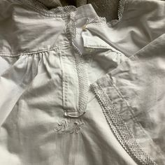 "From the Loire valley of France: Charming cotton dressing/nightgown.   Lovely heavy crispy white cotton, Just under 1lb! Sweet cotton lace around neck and sleeve. Wonderful hand sewn seams with some machine topstitching as well. Two button front with small hand embroider monogram BH.     Condition: Overall just lovely! Freshly washed and hung to dry.   A few tiny rust marks, see last photos.   Approximate measurements lying flat. Armpit to armpit 18\" Shoulders 15\" lace at end of sleeve 7.5\" White Cotton Long Sleeve Nightgown, Cottagecore White Sleepwear With Lace Trim, White Cottagecore Sleepwear With Lace Trim, Cottagecore White Nightgown With Lace Trim, Cotton Long Sleeve Nightgown With Lace Trim, Long Sleeve Cotton Nightgown With Lace Trim, Cotton Nightgown With Lace Trim Long Sleeve, White Cotton Cottagecore Sleepwear, Pastoral Cotton Dresses With Lace Trim