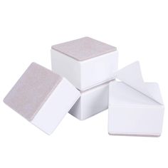 four square boxes with one white box and the other light pink, stacked on top of each other