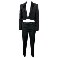 Product details: The blazer features dual front imitated pockets and front hook closure, black silk collar detail. Size 38. Length is 19", bust is 36.5", waist is 33". The trousers feature straight fit, formal design with geometric embroidered belt like detail around the waist area with belt loops for actual belt if needed, pocket on each side, one pocket on the back, folded bottom detail, hook and zipper front closure. Size 36. Length is 35.25", waist is 32", hips are 32", inseam is 12". Fitted Pantsuit With Lapel Collar For Parties, Fitted Evening Pantsuit With Pockets, Evening Fitted Pantsuit With Pockets, Tailored Party Sets With Pockets, Fitted Blazer With Pockets For Night Out, Fitted Suits With Belt Loops For Office, Fitted Formal Pantsuit With Belt Loops, Fitted Pantsuit With Belt Loops For Workwear, Elegant Fitted Pantsuit With Belt Loops