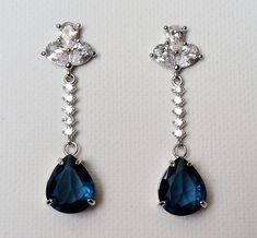 Navy Blue Teardrop Crystal Silver CZ Dangle Wedding Bridal Earrings. PLEASE READ ITEM DESCRIPTION and SHOP POLICIES before placing your order, and contact me with any questions! EARRINGS are about 1.53 inch (3.9cm) long from top of earring stud to bottom. BRIDAL EARRINGS SECTION: https://www.etsy.com/shop/LanaChayka?ref=seller-platform-mcnav&section_id=11638940 EARRINGS SECTION: https://www.etsy.com/shop/LanaChayka?ref=simple-shop-header-name&listing_id=95683858§ion_id=17999866&sort_order=date_desc NECKLACES SECTION: https://www.etsy.com/shop/LanaChayka?ref=seller-platform-mcnav§ion_id=17026331 Elegant and classy, these stunning earrings are perfect for weddings or special occasions such as birthdays, anniversaries, graduations, proms...or whatever you can imagine! Handmade earrings, are m Blue Drop Bridal Earrings For Formal Events, Blue Drop Bridal Earrings For Formal Occasions, Blue Drop Bridal Earrings, Blue Dangle Crystal Earrings For Formal Occasions, Blue Teardrop Chandelier Earrings For Formal Occasions, Formal Blue Teardrop Chandelier Earrings, Blue Teardrop Chandelier Earrings For Anniversary, Blue Drop Earrings For Bridal Formal Occasion, Blue Drop Earrings For Formal Bridal Wear