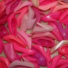 some pink and white plastic objects on a table