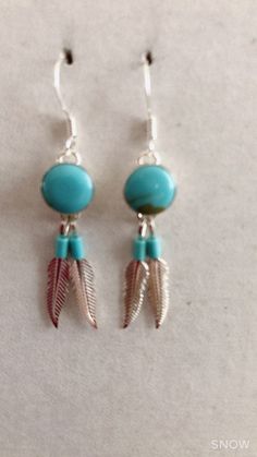 * Handmade item *925 Sterling silver * Gemstone: Kingman Turquoise *Dangle drop Earrings * 8mm Round Stone with 2 Feathers *Free gift box *Free shipping in USA *Ready to ship *Thank you for looking and check out more items in my Etsy shop for more great items and deals! *Https://www.etsy.come/shop/abq925 Adjustable Turquoise Jewelry With Feathers, Adjustable Silver Earrings With Feathers, Adjustable Silver Feather Earrings, Turquoise Feather Jewelry As Gift, Turquoise Feather Jewelry As A Gift, Adjustable Blue Feather Earrings, Southwest Jewelry, Turquoise Bead Necklaces, Handmade Earrings Beaded