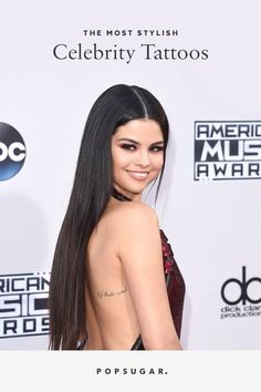 the back of a woman's dress at an american music awards red carpet event