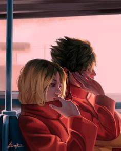 two people sitting next to each other on a bus