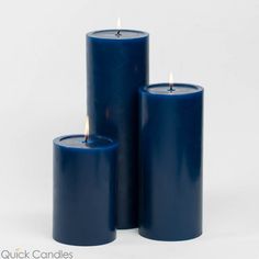 three blue candles sitting next to each other