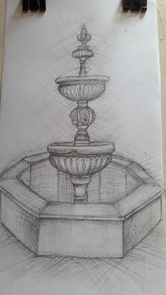 a drawing of a fountain on a piece of paper