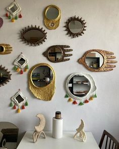 there are many decorative mirrors on the wall