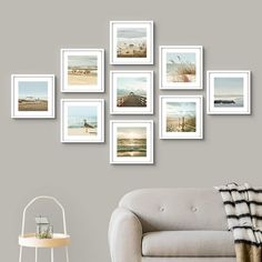 a living room filled with furniture and framed pictures on the wall above a chair in front of a table