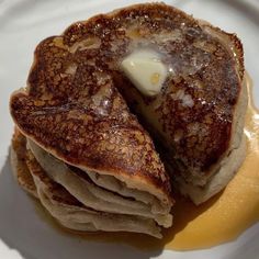 pancakes with butter and syrup on a plate