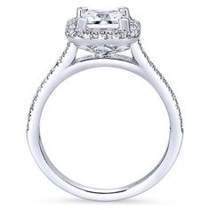 an 18k white gold halo style engagement ring