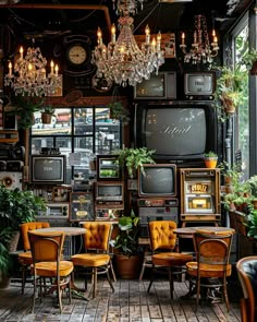 a room filled with lots of different types of tvs and plants on the wall