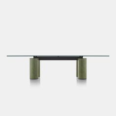 a glass table with two metal legs