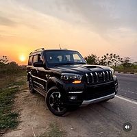 the jeep is parked on the side of the road