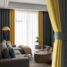 a living room filled with furniture and yellow drapes