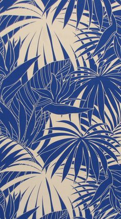 a blue and white wallpaper with palm leaves