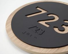 a black and wood plaque with the words rsi on it's center circle