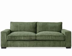 a green couch against a white background