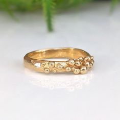 a gold ring sitting on top of a white table