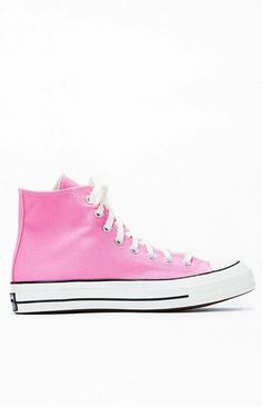 Step into timeless style with Converse's Pink Chuck Taylor All Star 70 High Top Sneakers. These iconic kicks blend vintage aesthetics with modern comfort, featuring premium materials and the classic Chuck Taylor design that effortlessly elevates your casual look..PLEASE NOTE: This shoe is offered in men's sizes; the conversion for Converse shoes is a size and a half smaller for women. For example, a woman who is a size 7 should order a size 5.5 in men's..Canvas upper.Lace-up front closure.High-top silhouette.Contrast stitching.Metal eyelets.Converse branding.Chuck Taylor All Star ankle patch Retro Converse Sneakers For Spring, Spring Retro Converse Sneakers, Vintage Pink High-top Sneakers, Retro Pink High-top Sneakers With Rubber Sole, Classic Pink Sneakers For Streetwear, Vintage Pink Low-top Sneakers, Pink Vintage Low-top Sneakers, Classic Pink High-top Sneakers, Converse Pink High-top Sneakers With Gum Sole